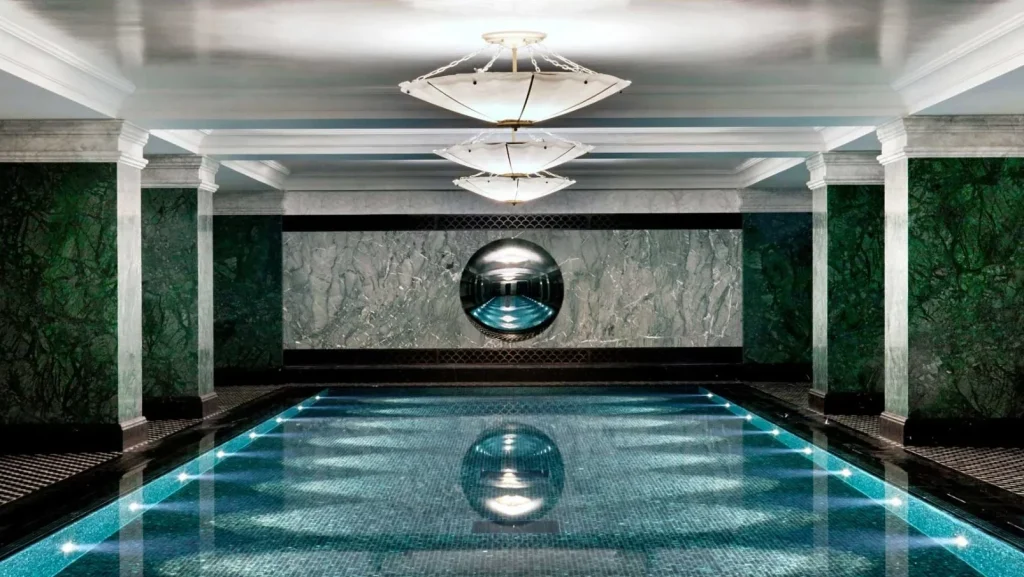 The indoor pool of The Ned London, a luxury design boutique hotel in London.